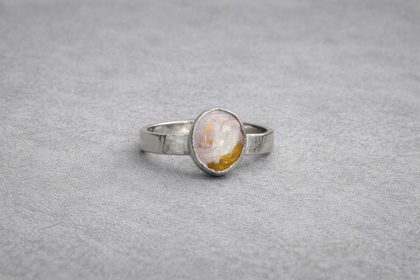 Wide band with oval setting